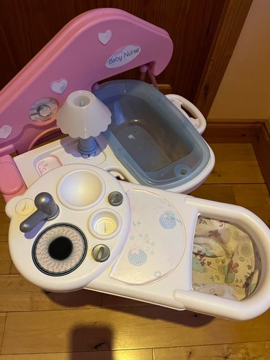 Baby doll play centre with high chair, bath and cot.