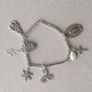Vintage sterling silver bracelet with charms. Please note that only one charm is not sterling silver. It is a small size, approximately 16/17 cm. Image 5