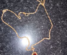 9ct gold necklace with ruby and diamond pendant