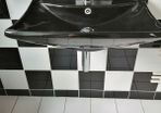 Unusual black bathroom sink with free tap