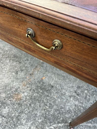 Maghoney wine leather desk with 2 drawers. Inlaid