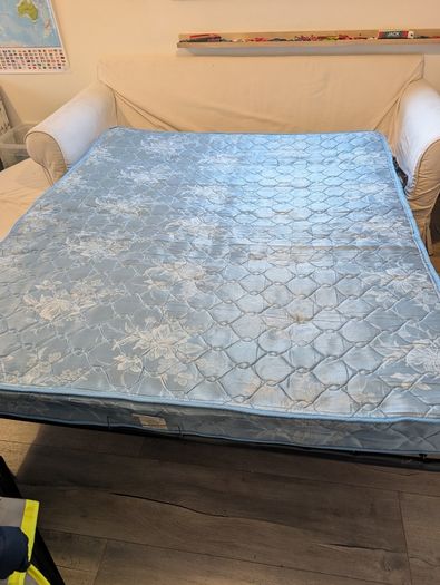 White sofa bed with pull-out mattress