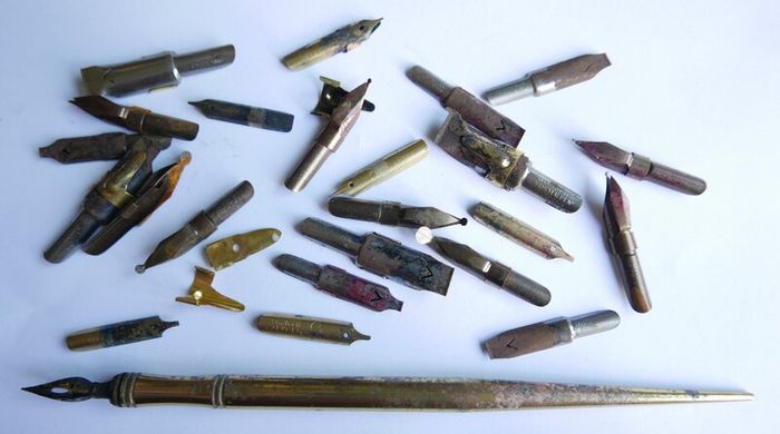 Vintage dip pen with collection of assorted nibs