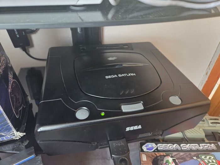 Sega Saturn w/ 3D Control Pad, Arcade Racer, Lightgun and Games
