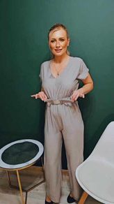 Jumpsuit with a decorative belt and tied back