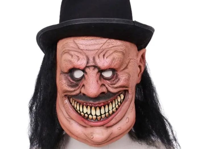 Zombie latex Halloween mask with hat and hair.