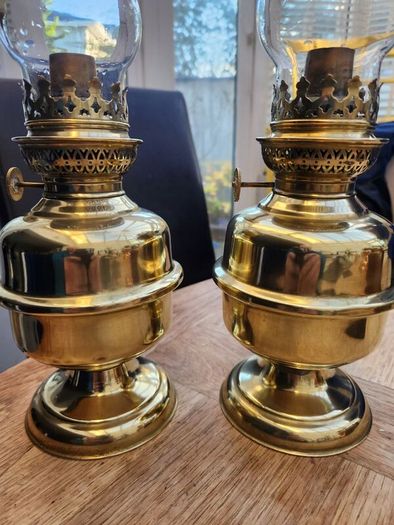 Matching pair of brass oil lamps.