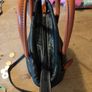David Jones  is a classic, two-tone black pebbled Faux leather bucket bag. Image 5
