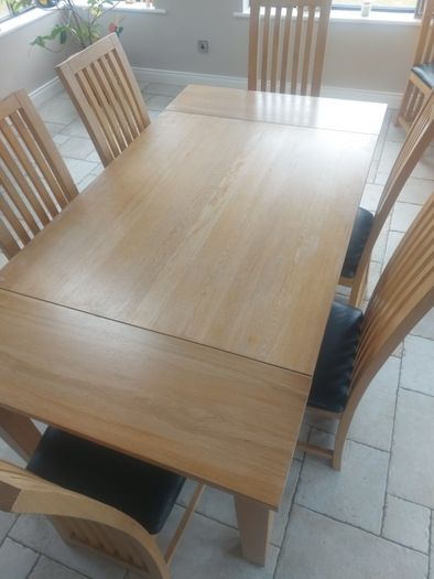 solid oak dining table and chairs