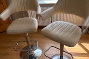 2 cream barstools