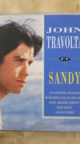 John Travolta. Sandy .