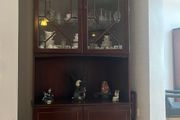 Tall corner display cabinet
