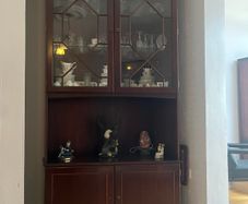Tall corner display cabinet