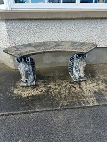 Stone garden bench horses