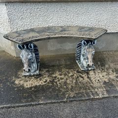 Stone garden bench horses