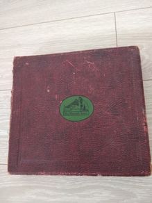 Antique book with 12 his master voice records