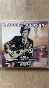 Robert Johnson. Contracted To The Devil.