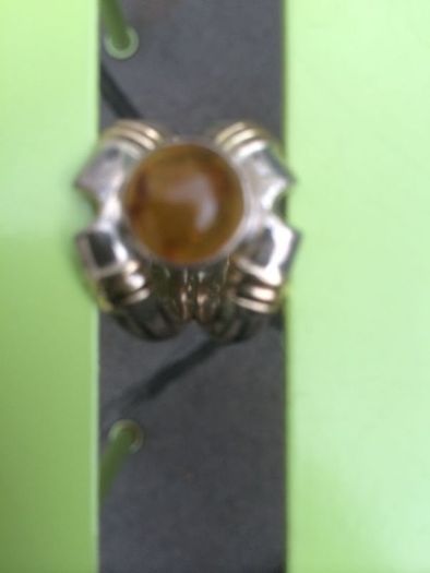A lovely silver and gold ring with Amber stone