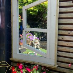 Garden mirror reflection window