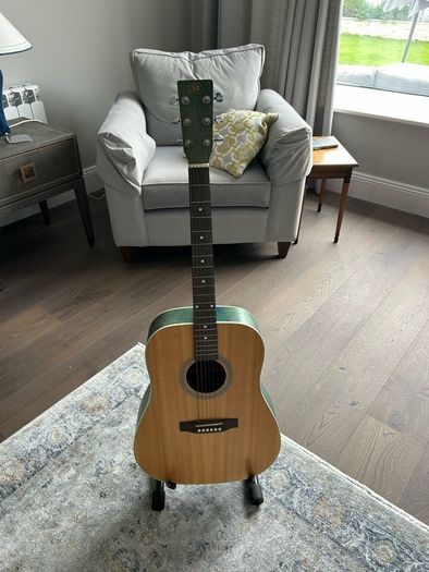 Acoustic guitar with strap, bag, stand and accessories