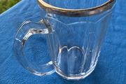Vintage pint glass in leather holder