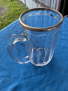 Vintage pint glass in leather holder