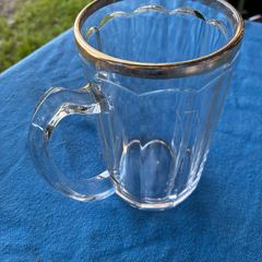 Vintage pint glass in leather holder