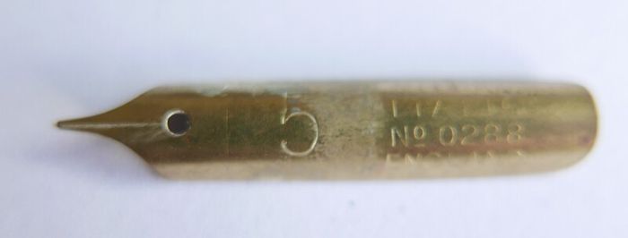 Vintage dip pen with collection of assorted nibs