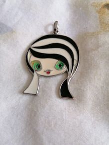 pendant of girls face.