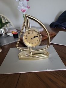 Clock in the shape of a sailboat