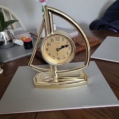Clock in the shape of a sailboat