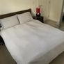 King size wooden bed with mattress and lockers Image 3