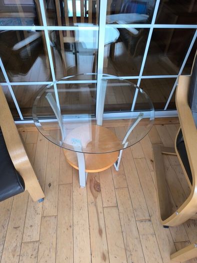 Ikea Poang brown leather chairs and matching footstool with occasional table
