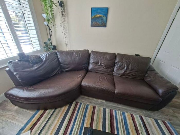 Leather sofa free for collection. There are small scratches on one side from the cat, otherwise it's in great condition.