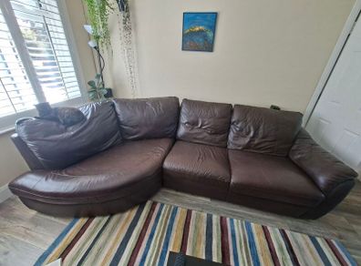 Leather sofa free for collection. There are small scratches on one side from the cat, otherwise it's in great condition.