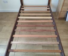 solid dark wood single bed frame