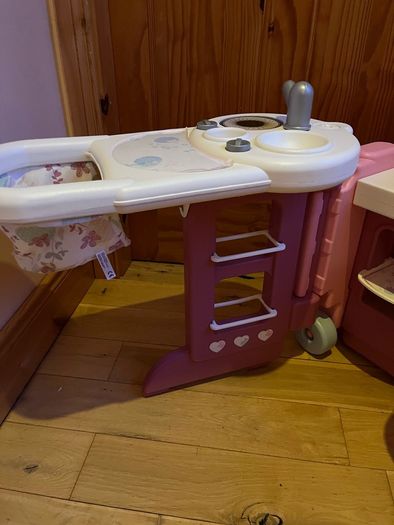 Baby doll play centre with high chair, bath and cot.
