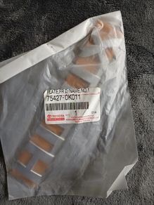Genuine Toyota Hilux 2005-2012, Part 75427-0k011 (plate, Front Door Name)