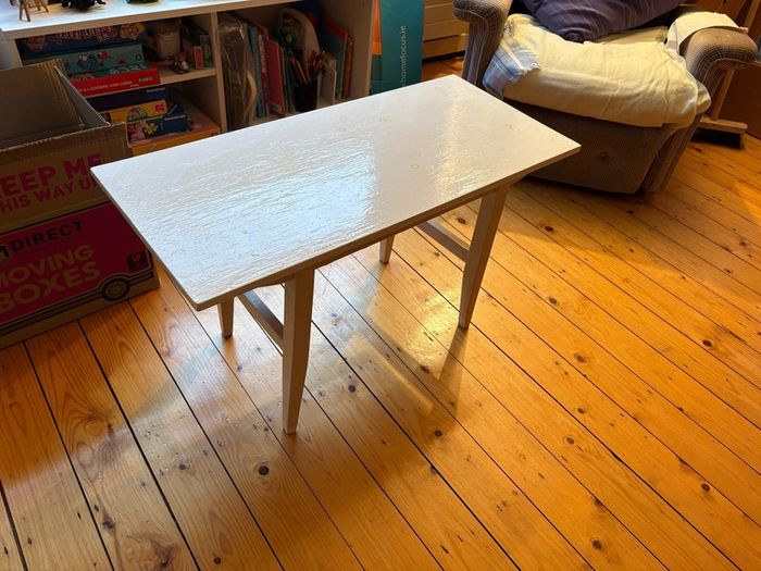 white table - needs a lick of paint but solid wood and very sturdy