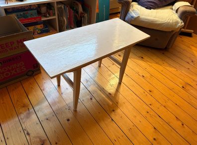 white table - needs a lick of paint but solid wood and very sturdy