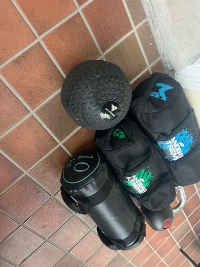 Sandbags, kettlebell, medicine ball