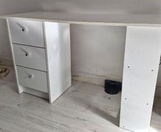 White desk with three drawers and side shelving