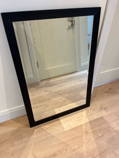 Black framed bevelled mirror