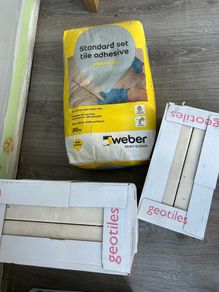 3 boxes tiles and adhesive