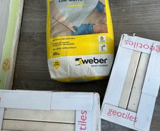 3 boxes tiles and adhesive