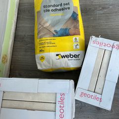 3 boxes tiles and adhesive