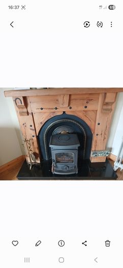 Timber surround with cast iron insert for fireplace