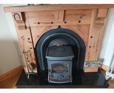 Fireplace timber surround and cast iron inset