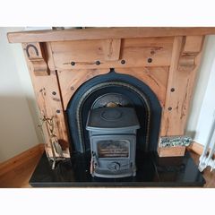 Fireplace timber surround and cast iron inset