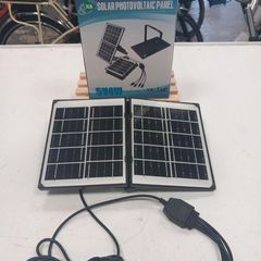 Small portable solar panel with leads for charging your phone (Brand New)